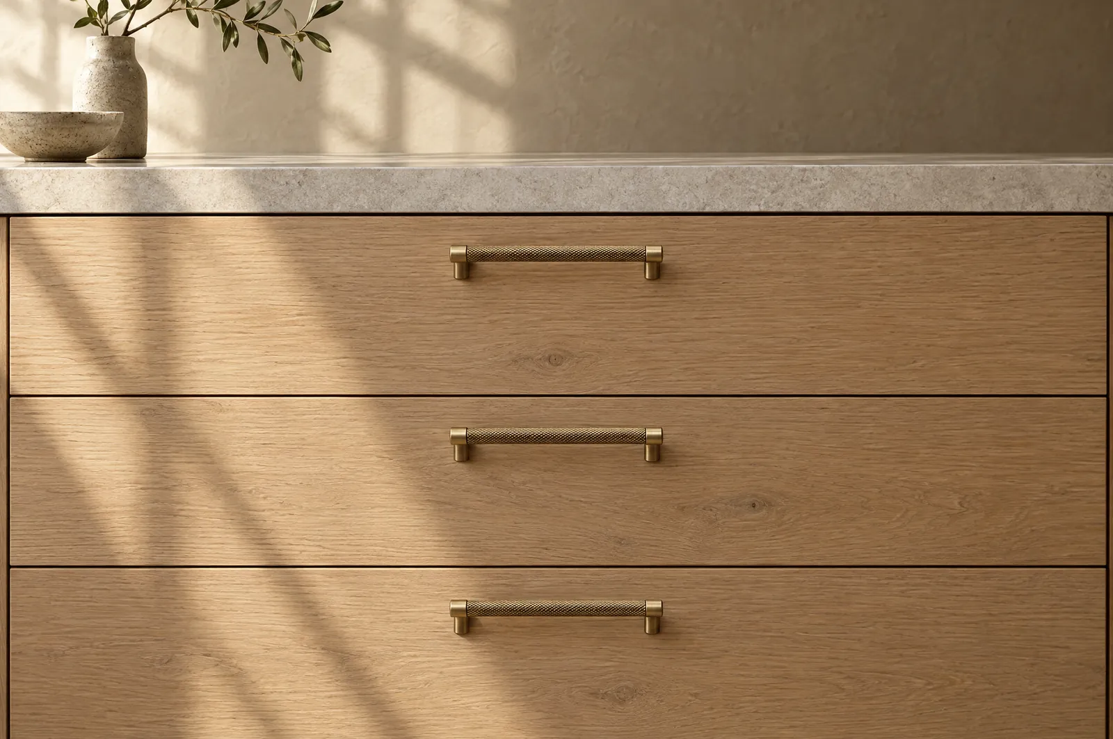 Oak kitchen drawers with knurled brass bar pulls