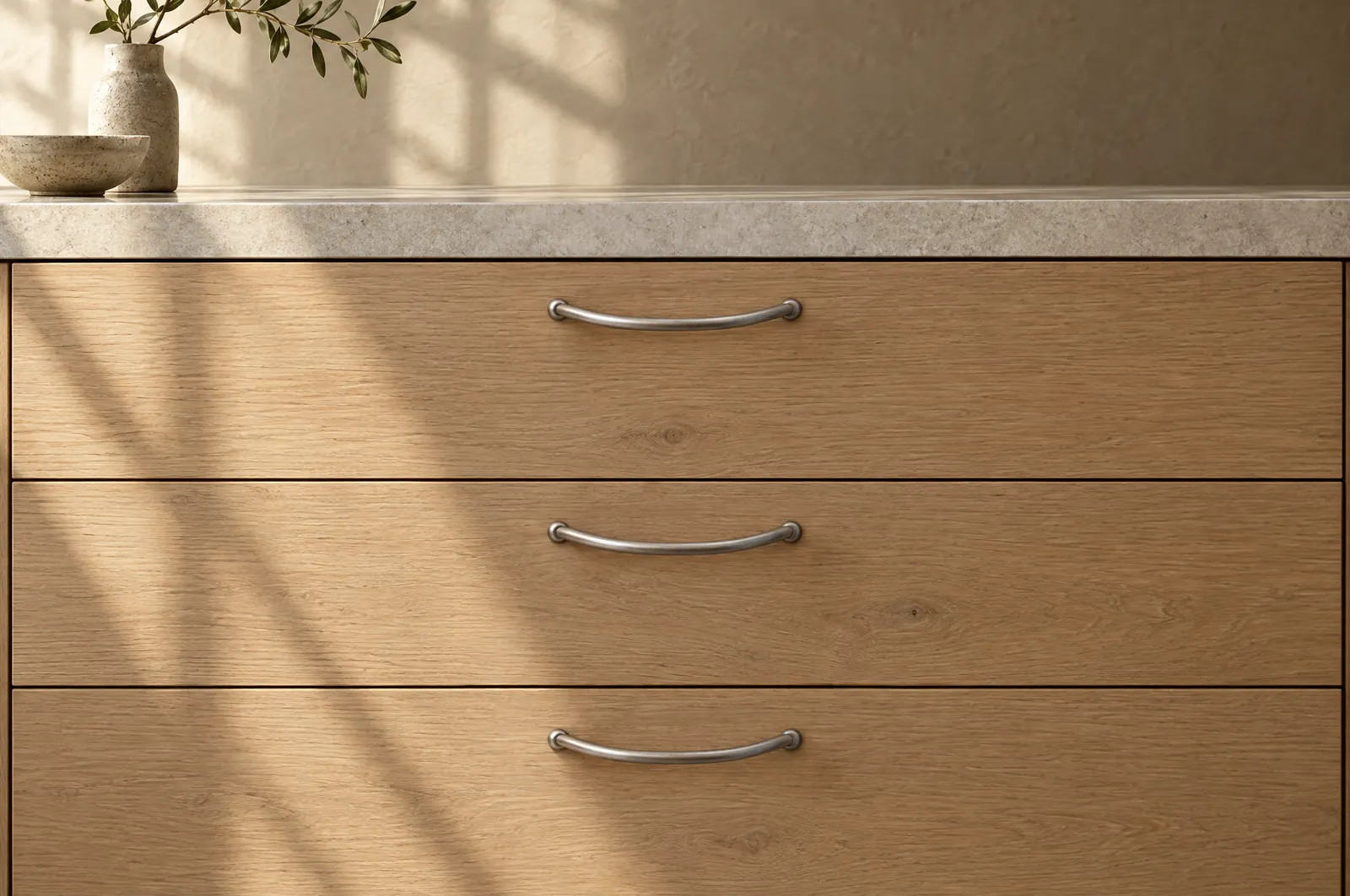 The same oak drawers with dated steel bow handles