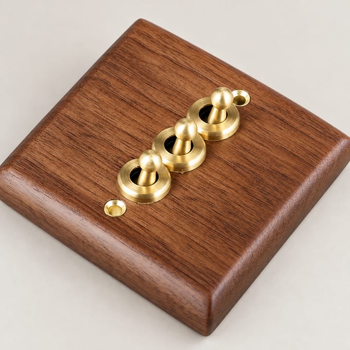 The Walnut and Brass Switch Plate